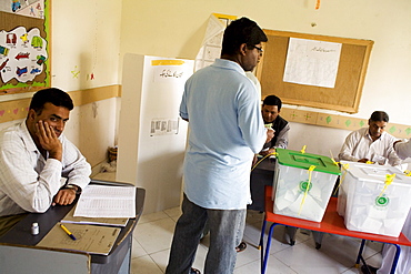 A bored poll worker on election day in Karachi, Pakistan  on February 18, 2008.