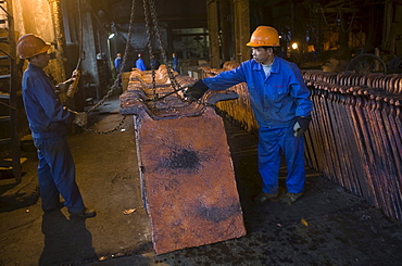 Chinese workers labor at a copper smelter in Tongling in China's central Anhui Province. The smelter refined some of the metals that will be used in the 2008 Summer Olympic medals to be held in Beijing.