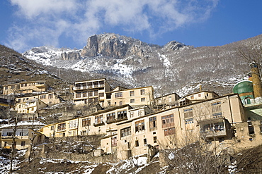 Masuleh, Iran - February, 2008: Quaint mountain village of Masuleh in North Western Iran with its charming earth colored houses stack on each other clinging to the steep mountain side.