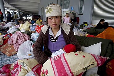 Liu Chunnan, 22, with her 10 day old baby in a camp for people whose homes were destroyed in the Sichuan earthquake. 5/15/2008