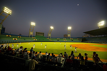 Havana's baseball team, the Industriales, warm up at Estadio Lantinoamericano, the main baseball stadium in Havana, Cuba