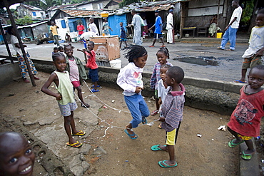 Monrovia, Liberia - September 18, 2007: Children skipping in the street in the fishing community of West Point in the Liberian Capital of Monrovia. The fishing industry is an important source of employment and food for Liberians and is increasingly under threat by better equipped and unregulated foreign vessels over fishing in its unprotected waters.