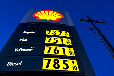 Low angle view of a Shell gas station sign depicting 7 dollar a gallon gas near Burns, Oregon.