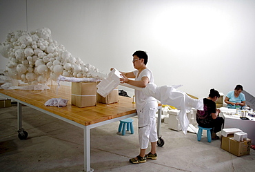 Chinese artist Lin Tianmiao works on the sculpture "Mothers !!! no. 14"  in her studio in Songzhuang Village, east of Beijing.