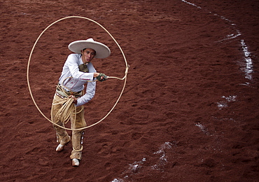 A Mexican Charro uses a lasso as he competes in a Charreria, or rodeo, Mexico's national sport,  in Texcoco, Mexico, October 28, 2007.