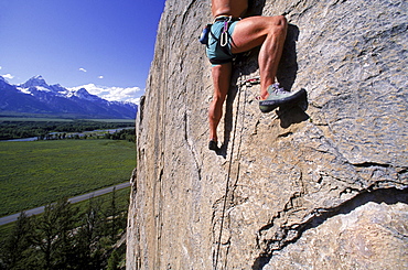 Climbing on Blacktail Butte with a view of the Tetons to the west.