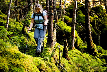 An athletic female hiker hikes the Franconia Ridge Trail.