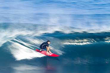 A surfer, captured in Speed Blur fashion at world famous Pipeline, on the north shore of Oahu, Hawaii.