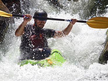 Man kayaks in whitewater rapids on Wilson Creek, NC.