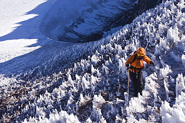 A woman mountain climbing on Volcan San Jose in the Andes mountains of Chile