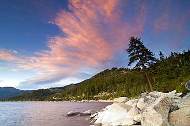 Clouds are illuminated at sunset over the east shore of Lake Tahoe, Nevada.