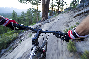 Jake Dore mountain biking on the Corral Trail in Lake Tahoe, California.