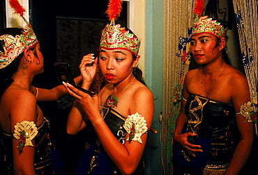 Javanese young women prepare for dance performance in Paramaribo, Suriname.