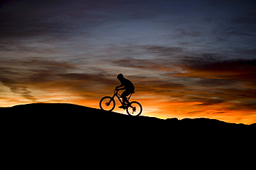 mountain biker at sunset, Moab, Utah