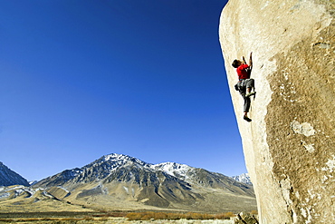 Man lead climbing