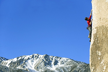 Man lead climbing