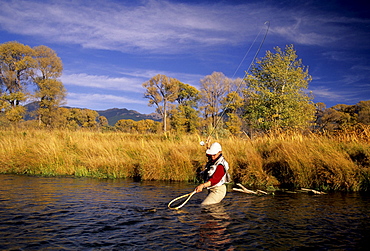 A person netting trout on the Bighorn River in Montana.