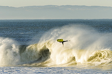 Bodyboarder flies high at sunrise in Nazare Special Edition contest held in Nazare, Portugal.