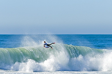 Bodyboarder landing an air reverse at Nazare Special Edition, help in Portugal.