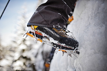 Boots and crampons on an ice wall in Whistler, British Columbia, Canada, Whistler, British Columbia, Canada