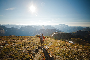 A hiker walks along a trail in North Cascades National Park, North Cascades National Park, Washington, United States