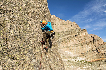 A man rock climbing the granite Flying Buttress of Mount Meeker in Rocky Mountain National Park, Estes Park, Colorado, Estes Park, Colorado, usa