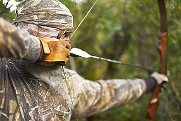 Bow Hunter aims recurve bow, Pagosa Springs, CO, USA