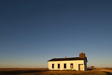 An abandoned church on the high plains of eastern New Mexico greets the morning light, New Mexico, USA