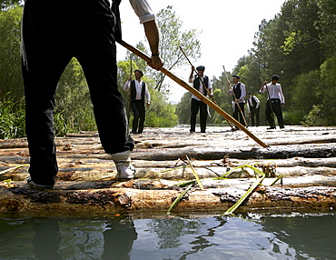 A ganchero was a person dedicated to a craft of assisting in the transport of a large quantity of loose logs floating downstream. by the river Tagus.