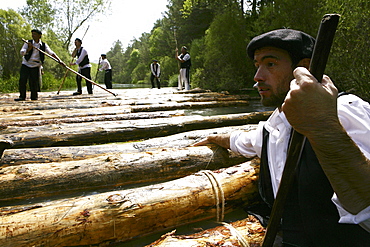 A ganchero was a person dedicated to a craft of assisting in the transport of a large quantity of loose logs floating downstream. by the river Tagus.