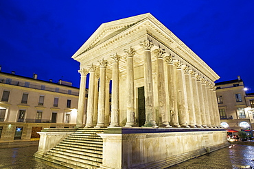 Maison Carrée ancient Roman temple on Place de la Maison Carrée at night, Nîmes, Languedoc-Roussillon, Gard Department, France