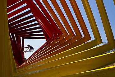 A young man performs different parkour jumps in several locations at the National University (UNAM), in Mexico City