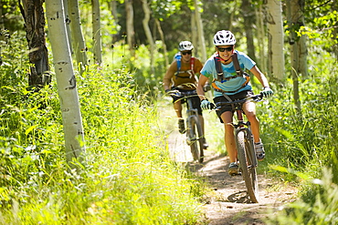 Stacy Phillips and Cody Barnhill mountain biking at The Canyons Resort, Park City, Utah.