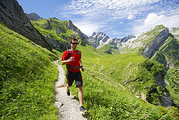 Romain Burgat-Charuillon hiking in the mountains of Appenzellerland, Switzerland.