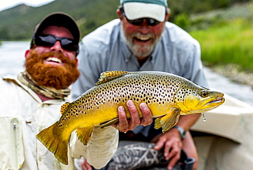 Two men with a 21 inch Brown on the Green River