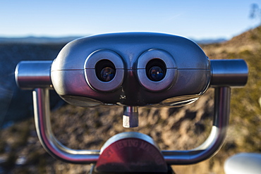 Public binoculaurs at an overlook at Bandelier National Monument.