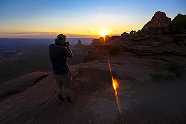 A photographer shoots the sunset at Canyonlands National Park near Moab, Utah.