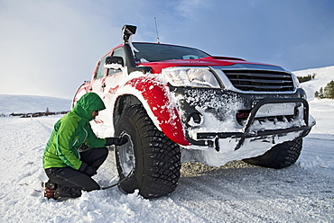 reinflating tyres of a customised 4x4 pick up truck close to Laugar in north Iceland