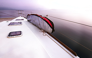 sailboat deck and surfboard on ocean