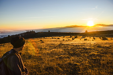 Hiker looking at sunrise