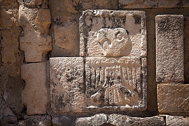 A stone relief with the image of a Guacamaya decorates a temple in the Mayan city of Uxmal, Yucatan Peninsula, Mexico