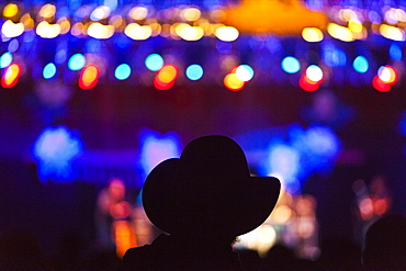 An audience member in a cowboy hat at the Telluride Bluegrass Festival in Telluride, Colorado.