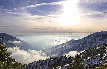 Sunlight over the San Gabriel Mountains seen from Devils Backbone on Mt Baldy.