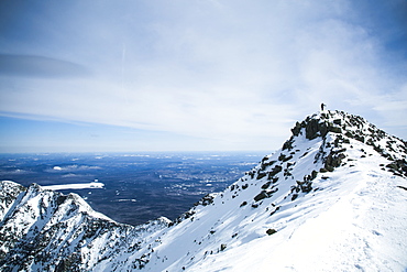 Hiking the Knife Edge trail during the winter on Katahdin in Baxter State Park, Maine.