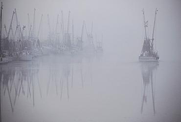 A hazy view of shrimp boats in Darien, Georgia, USA,