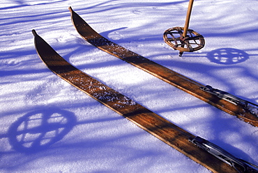 A pair of wooden skis lying on the snow, Maine, North America, USA,