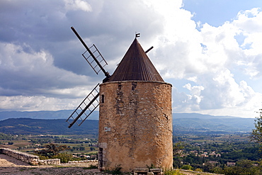 An old olive mill looks out over the hill village of St-Saturnin-les-Apt.