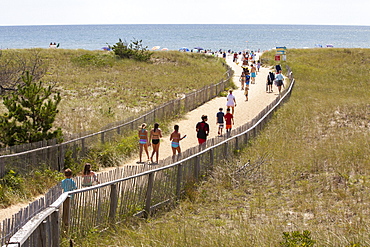 Beach goers walk down to Nantucket's popular Surfside Beach on the island's south side.