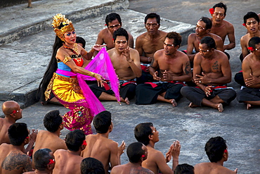 Traditional Indonesian dancers perform at Uluwatu Temple in Bali, Indonesia