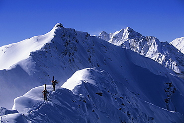 Chris Davenport and Matt Ross hiking ridgeline at Aspen Highlands, CO, United States of America